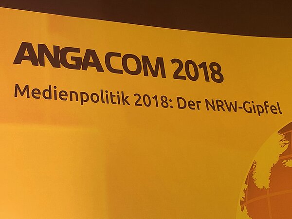 Schriftzug ANGACOM - Medienpolitik 2018: Der NRW-Gipfel